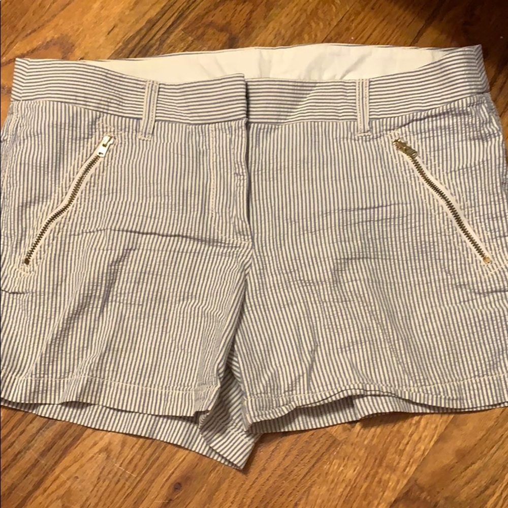 A pair of J. Crew shirts